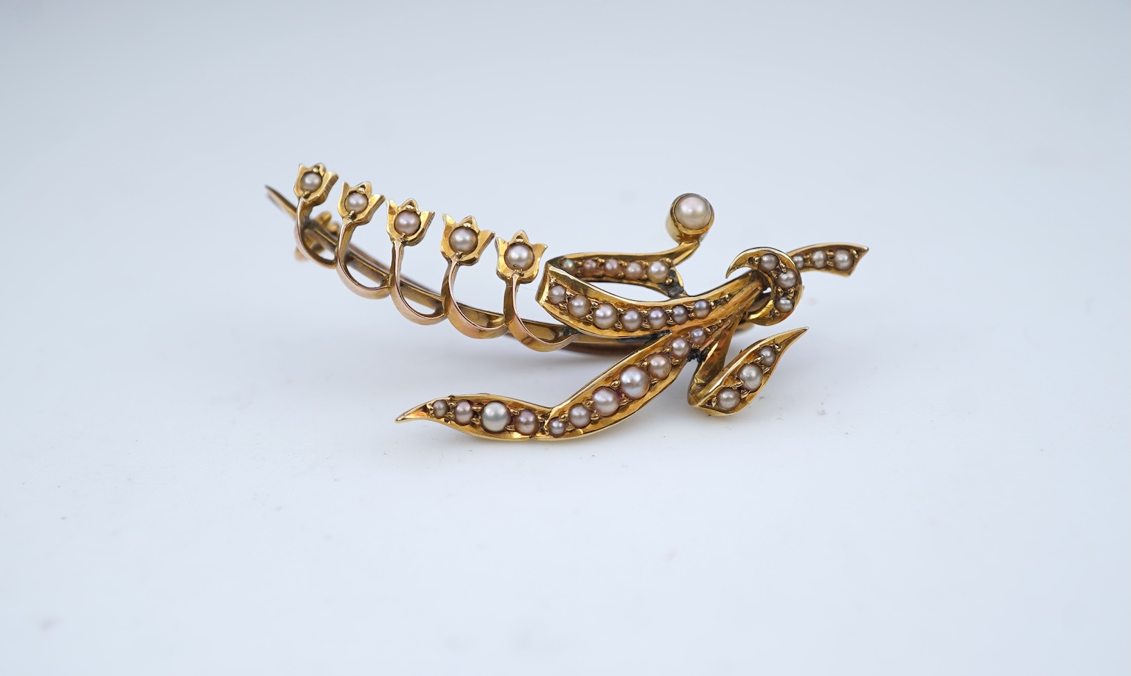 An Edwardian gold and seed pearl brooch, early 20th century
